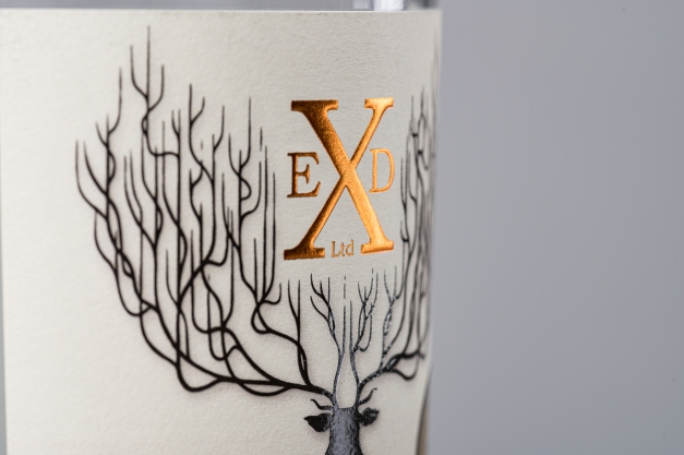 English Spirit Distillery label printed on tintoretto stock. Label includes foiling and has been placed on a bottle.